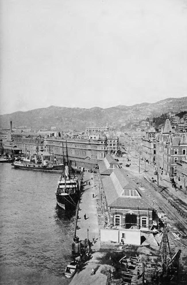 A 1913 view over a busy New Zealand waterfront, wharves and moored ships seen from above