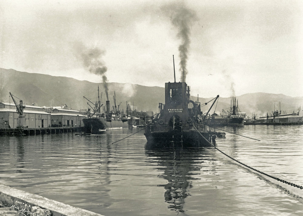 An early 1900s postcard photograph of the steam dredge Whakarire working in a harbour